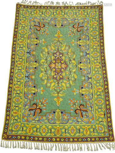 An Iranian lined silk tapestry wall hanging, the central oblong panel with floral motif in purple,