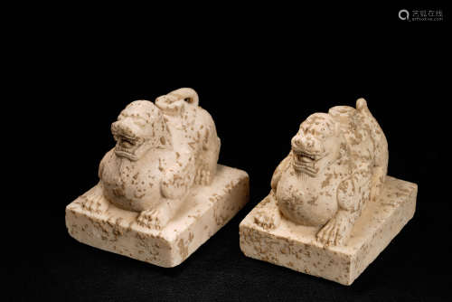 A Pair of Chinese Carved Stone Foo-Dogs
