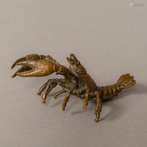 A small bronze model of a lobster Naturalistically modelled. 10 cm long.