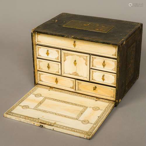 An 18th century chinoiserie lacquer and ivory table cabinet Of typical rectangular form,