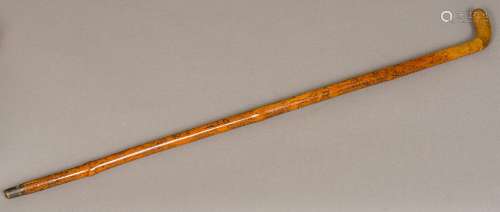 A 19th century Folk Art engraved treen walking stick Decorated in the round with various domestic