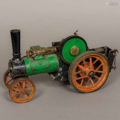 A vintage scale model of a steam plough engine 40 cm long.