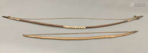 Two Fijian tribal bows Each of typical form. The largest 175 cm long.