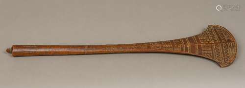 A 19th century Fijian Dui war club Of typical form, with carved geometric decoration. 69 cm long.