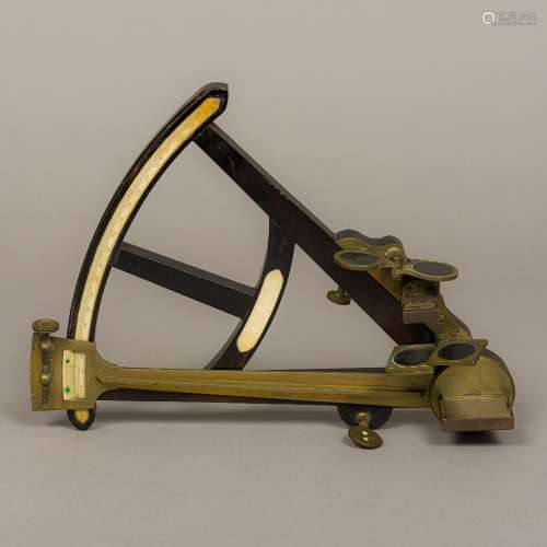 A 19th century ivory and brass mounted octant Of typical form, with multiple lenses. 33 cm high.