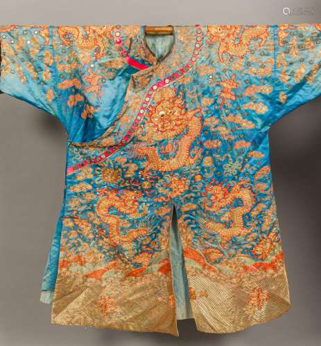 A 19th century Chinese embroidered silk robe Decorated with dragons amongst clouds,