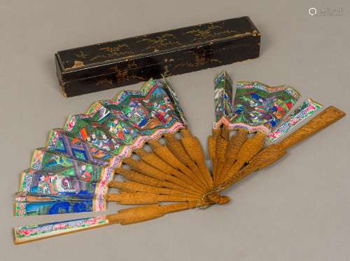 A 19th century Canton fan With carved and wooden guards and sticks,