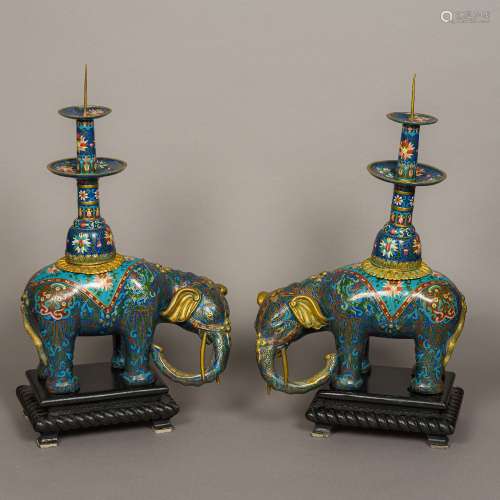A pair of Chinese cloisonne type decorated pricket stick censers Modelled as elephants,