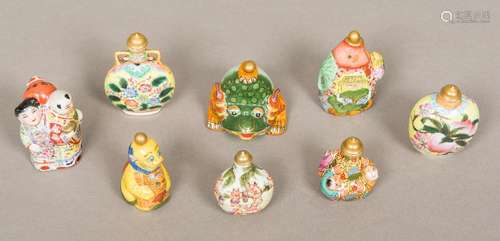 Eight Chinese porcelain snuff bottles and stoppers Various moulded/decorated.