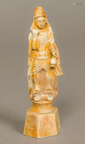 A Chinese fossilized ivory carving of a figure Modelled holding a gourd, standing on a plinth base.