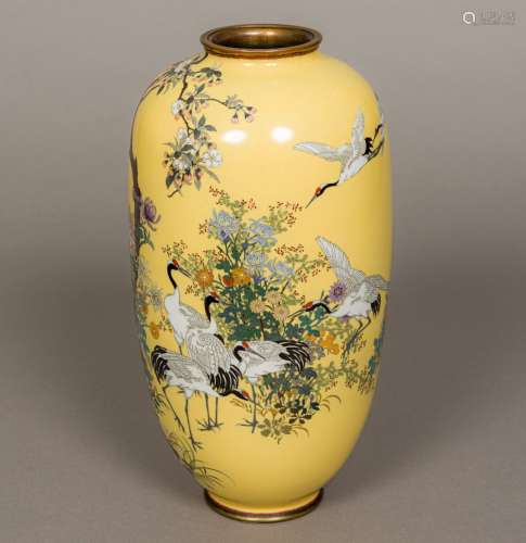 A Japanese cloisonne vase Decorated with cranes amongst floral sprays on a sand coloured ground,