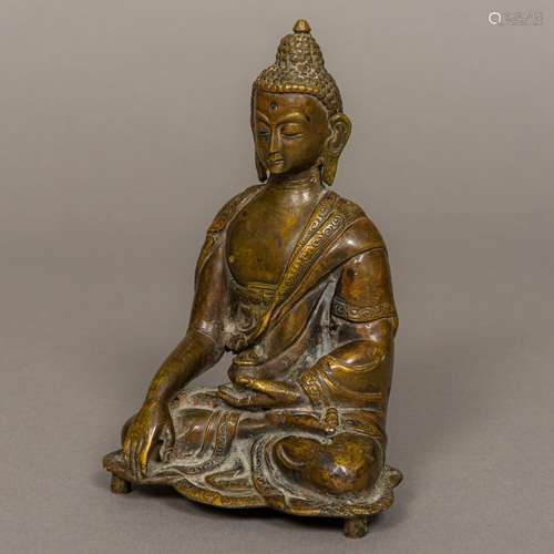 A Chinese bronze Buddha Typically modelled. 17 cm high.