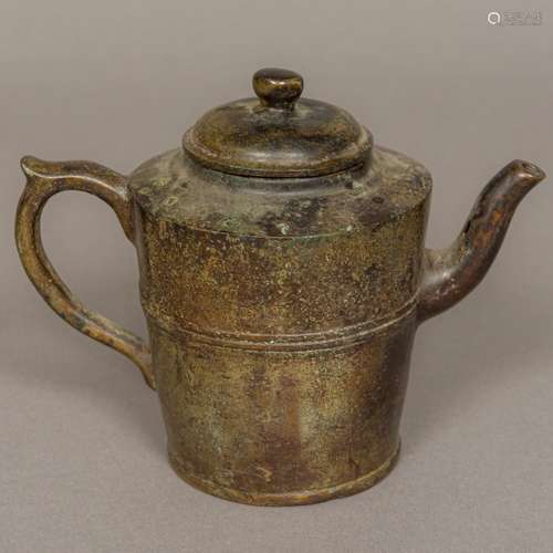 A Chinese bronze cast teapot and cover With banded decoration and cast single character mark. 13.