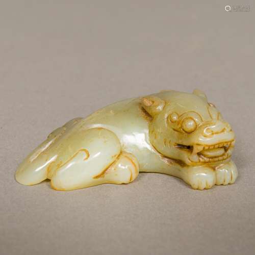 A Chinese carved jade group Worked as a recumbent temple lion and a bat. 9 cm wide.