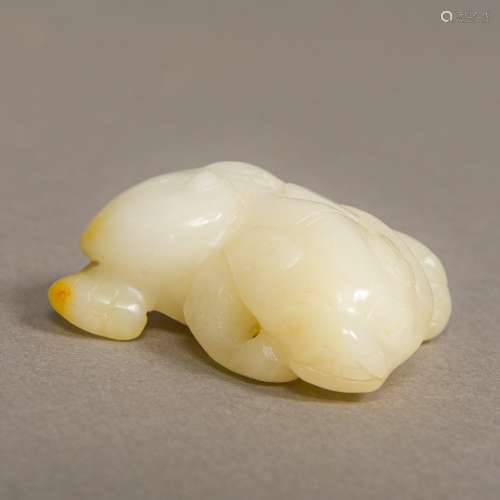 A Chinese carved jade group Worked as a recumbent mythical beast. 5 cm wide.
