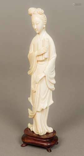 A late 19th/early 20th century Chinese carved ivory figure of Guanyin Typically worked. 23 cm high.