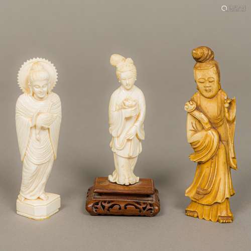 A late 19th century Chinese carved ivory figure of Guanyin Typically modelled holding a flower,