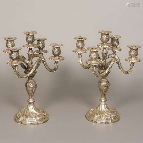 A pair of 925 sterling silver candelabras Each with scroll cast drip-pans above the scrolling