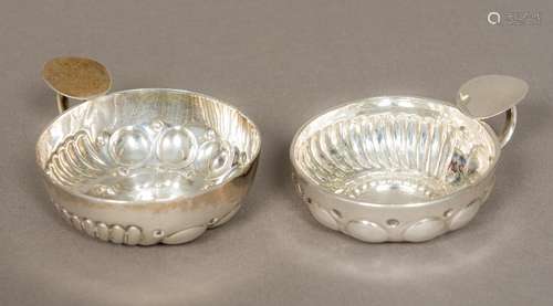 Two French silver wine tasters Of typical form. The larger 8 cm diameter.