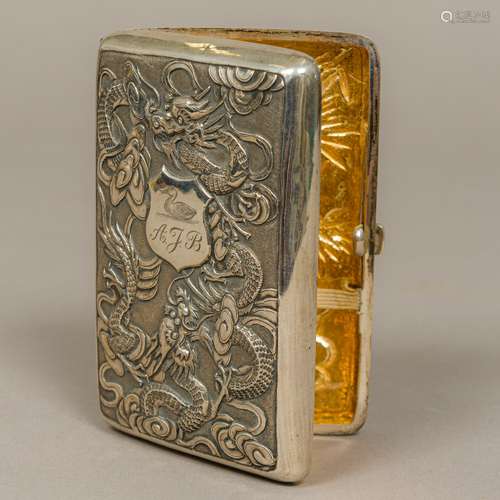 A late 19th/early 20th century Chinese silver cigarette case Embossed to the front with dragons