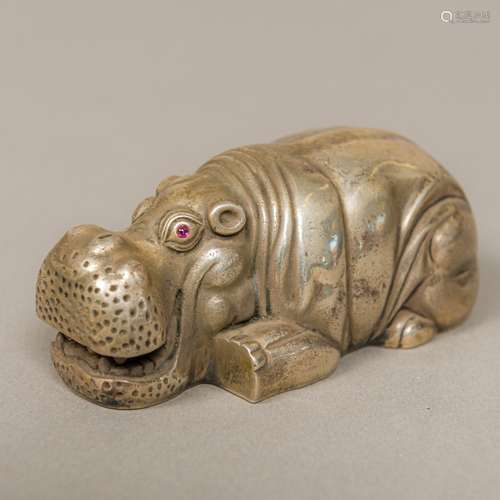 A novelty silver animalier model Formed as a hippopotamus with inset ruby cabochon eyes,