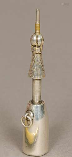 A white metal novelty propelling pencil by Hamilton & Co., Calcutta Modelled as a champagne bottle.