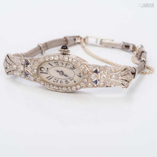 An Art Deco platinum, diamond and sapphire set lady's cocktail watch Of pierced navette form,