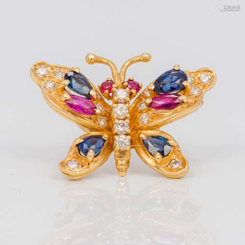 A 14K gold diamond and gem set brooch Worked as a butterfly. 2.8 cm wide.