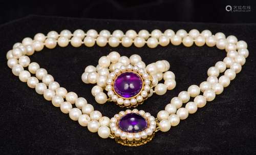 A two strand pearl bead necklace With amethyst set 750 gold clasp;