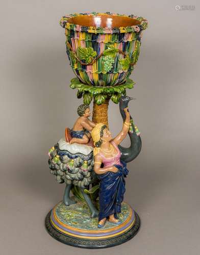 A 19th century majolica jardinere on stand by Gerbing & Stephan The jardiniere of basket weave form