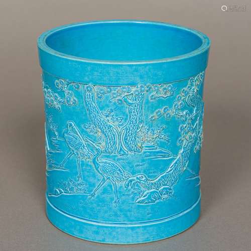 A Chinese porcelain brush pot Worked with birds in a continuous landscape with all over turquoise