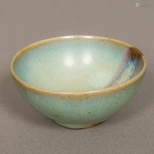 A Chinese Jin Dynasty Jun Ware pottery bowl With typical glaze. 8 cm diameter.