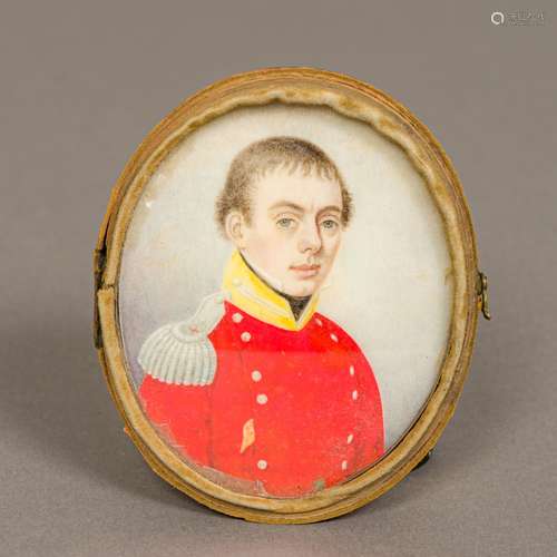 An early 19th century portrait miniature on ivory Depicting a young military officer in red tunic