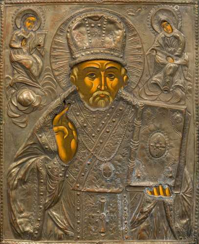A Russian painted icon Typically worked with plated oklad, variously inscribed. 26.5 x 32.5 cm.