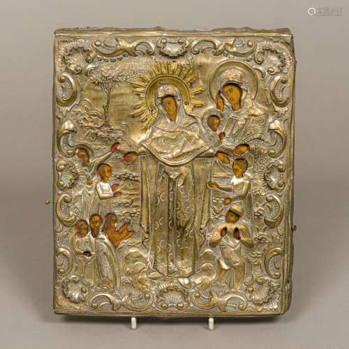 An 18th/19th century Russian gilt metal clad painted wooden icon Depicting the Virgin Mary and