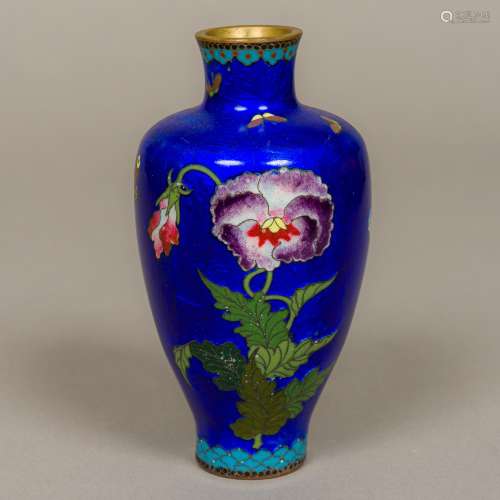 A small cloisonne vase Decorated with butterflies amongst floral sprays on a blue ground.