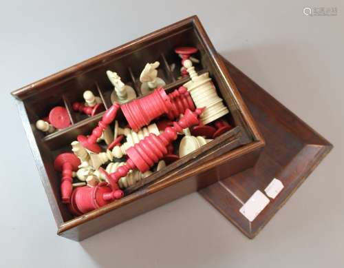 A 19th century bone and stained bone chess set Boxed. The kings each 15 cm high.