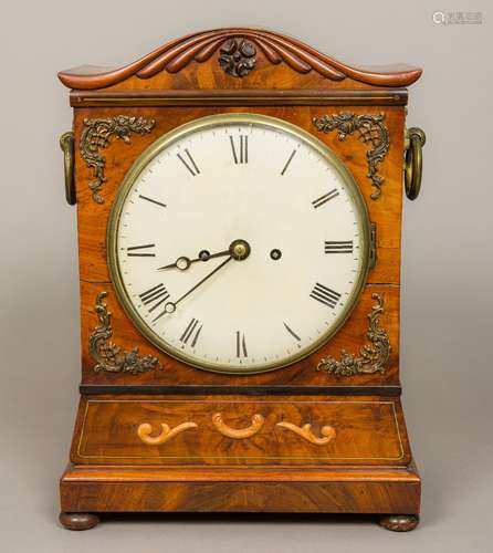 A 19th century mahogany bracket clock The serpentine top above the white dial with Roman numerals