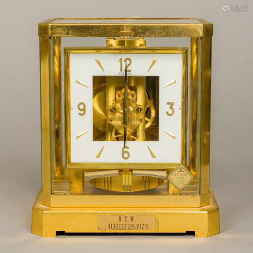 A LeCoultre Atmos clock Of typical form, with lacquered brass case,