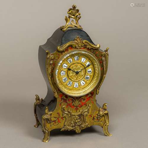 A 19th century Boulle mantel clock The shaped top surmounted with a floral cresting,