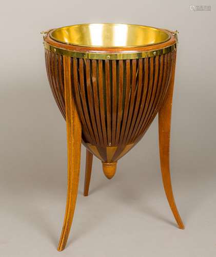 A brass mounted line inlaid mahogany coal bucket Of pierced horizontal banded form,