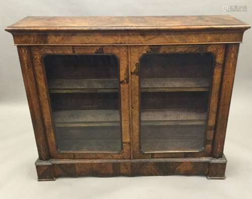 A Victorian inlaid burr walnut glazed side cabinet The moulded rectangular top above the plain