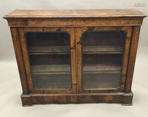 A Victorian inlaid burr walnut glazed side cabinet The moulded rectangular top above the plain