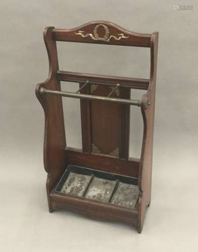 A Victorian Arts & Crafts brass mounted walnut stick/umbrella stand,
