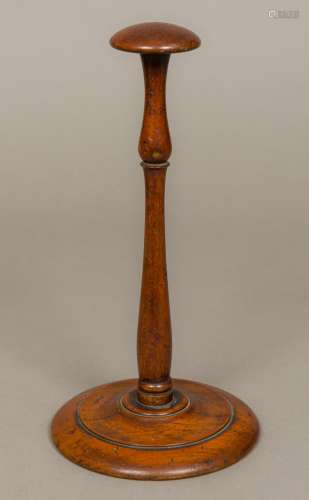 A 19th century turned mahogany wig stand Of typical form. 28 cm high.