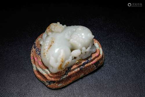 A Chinese Carved Jade Foo-Dog