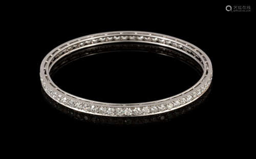 8 Carat Tiffany & Co. Platinum Bangle Bracelet. Bead set all the way around with a total of sixty