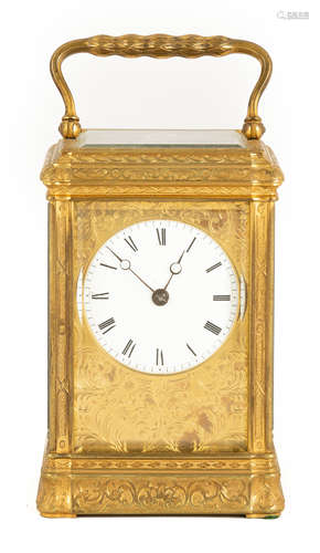 French Carriage Clock. 19th century. Gilt bronze and beveled glass case with porcelain dial. 8 day