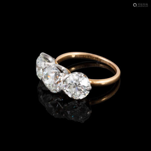 Tiffany & Co. 18kt Gold & Diamond Ring. Each setting has one old European cut diamond. The center