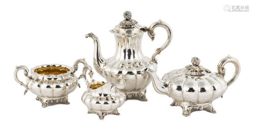 English Four Piece Sterling Tea Set. Melon form with hand chased design and melon finial. 71.5